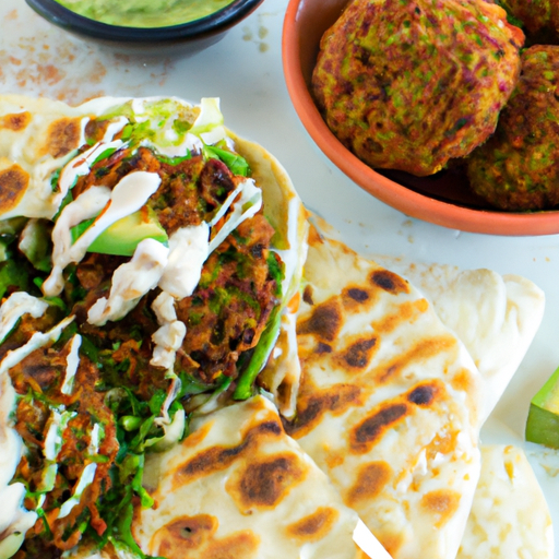 An image that showcases a golden, crispy falafel patty adorned with vibrant green avocado spread